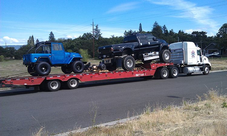 F650 and a Jeep being carried to 1000 Islands Poker Run