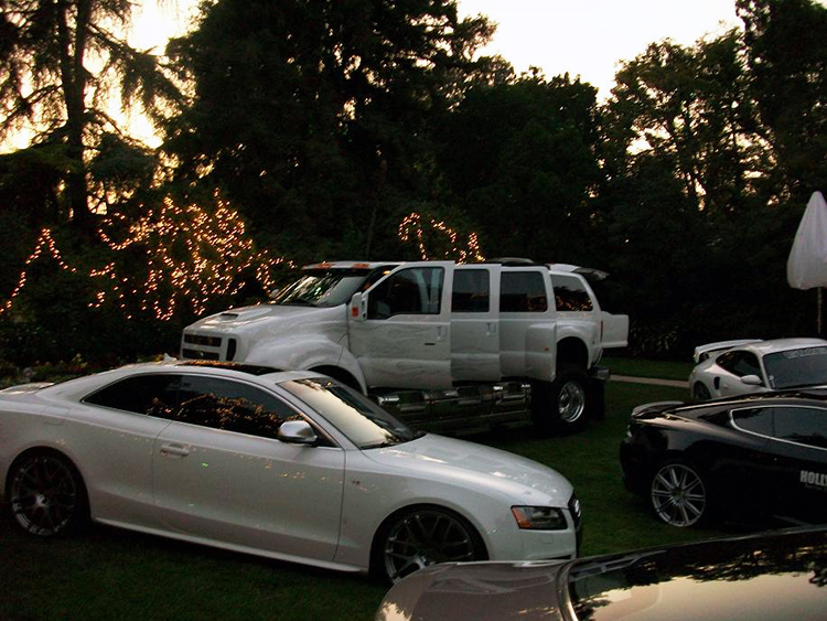 Biggest pickup Ford makes hangs out with some fast cars at the Playboy Mansion