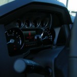 Black six-door Ford F650 interior- dash on passenger's side